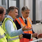 PAS 110-certified digester gets cabinet seal of approval Grundon Waste Management's Clayton Sullivan-Webb, Harry Waters of Agrivert and Foreign Secretary Philip Hammond
