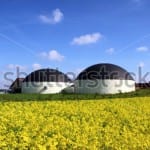 stock-photo-bio-gas-plant-in-a-rape-field-145873403