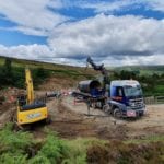 Crane vehicle assists with flood-damaged dales