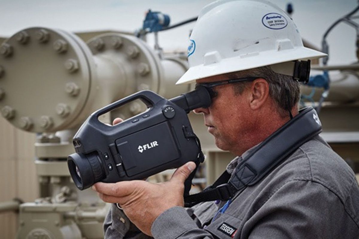 man-holding-camcorder-on-site