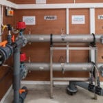 Partnership addresses potable priorities pipes on wall