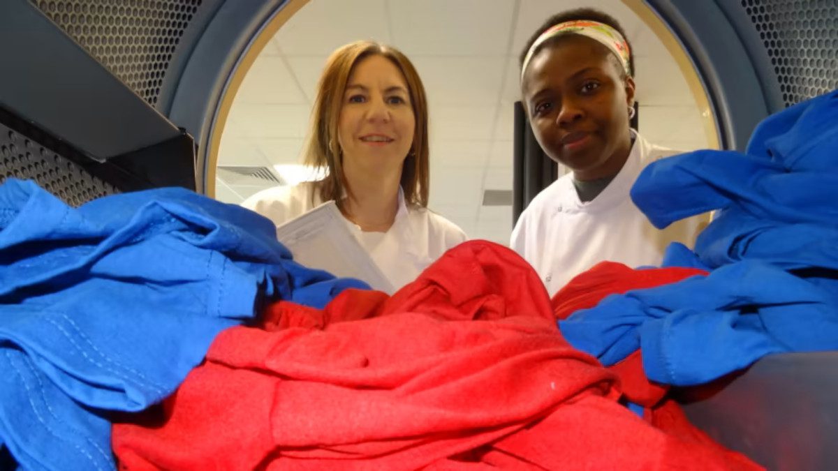 Dr-Kelly-Sheridan-and-PhD-student-Chimdia-Kechi-Okafor-with-a-test-load-in-a-tumble-dryer