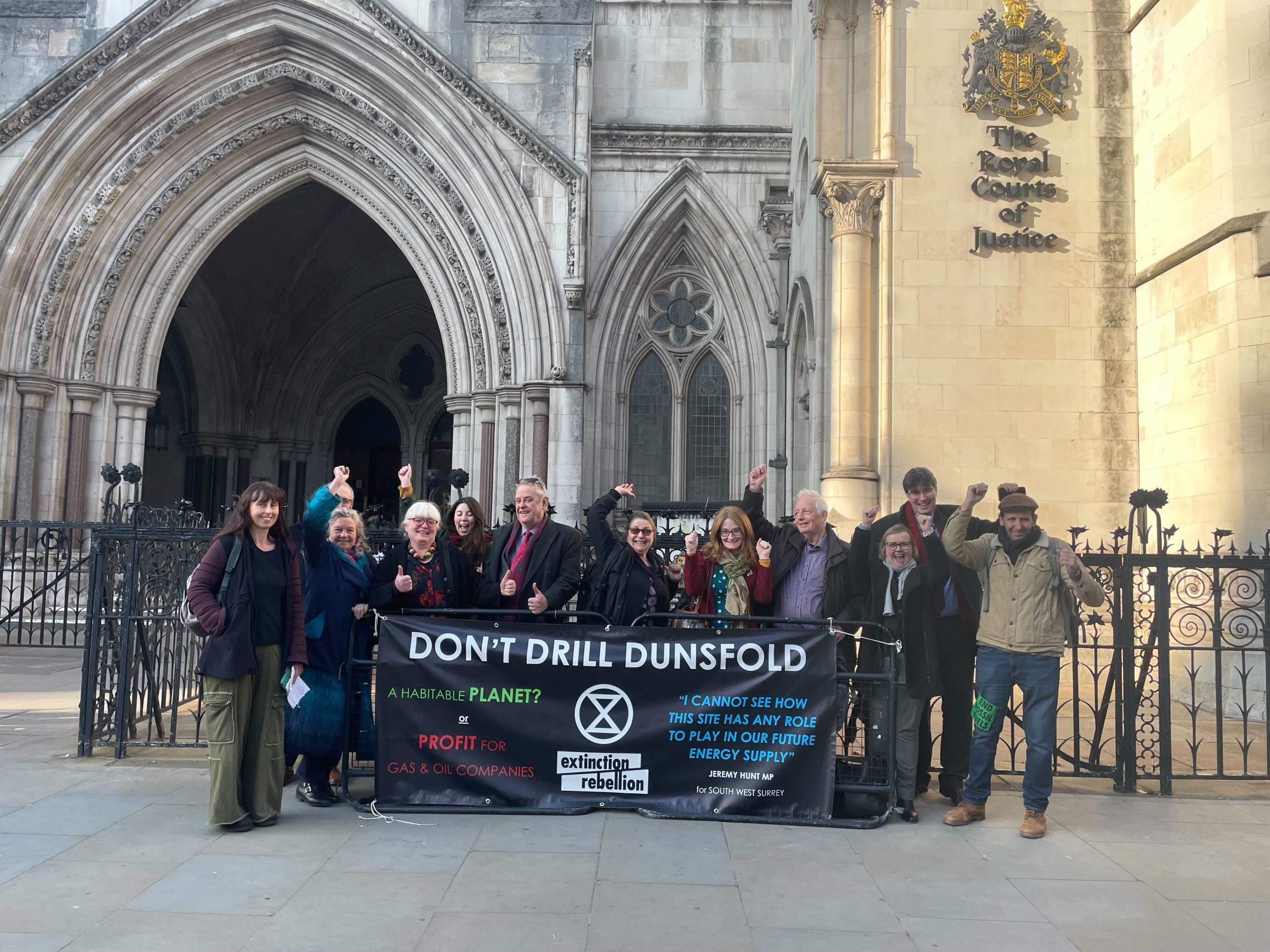 Dunsfold-campaigners-celebrating-outside-the-Royal-Courts-of-Justice-in-March