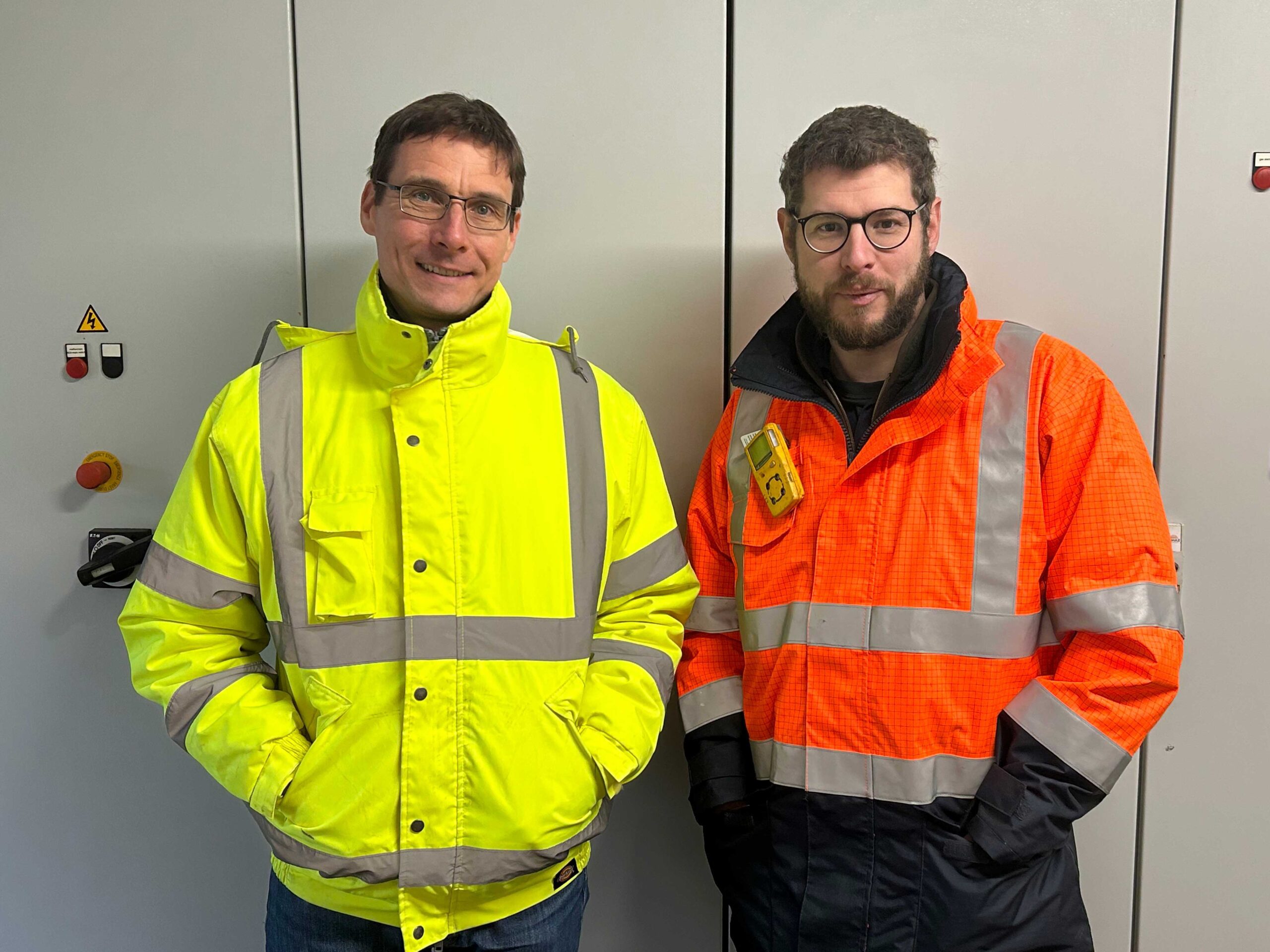 FM Bio employees in reflective safety jackets.