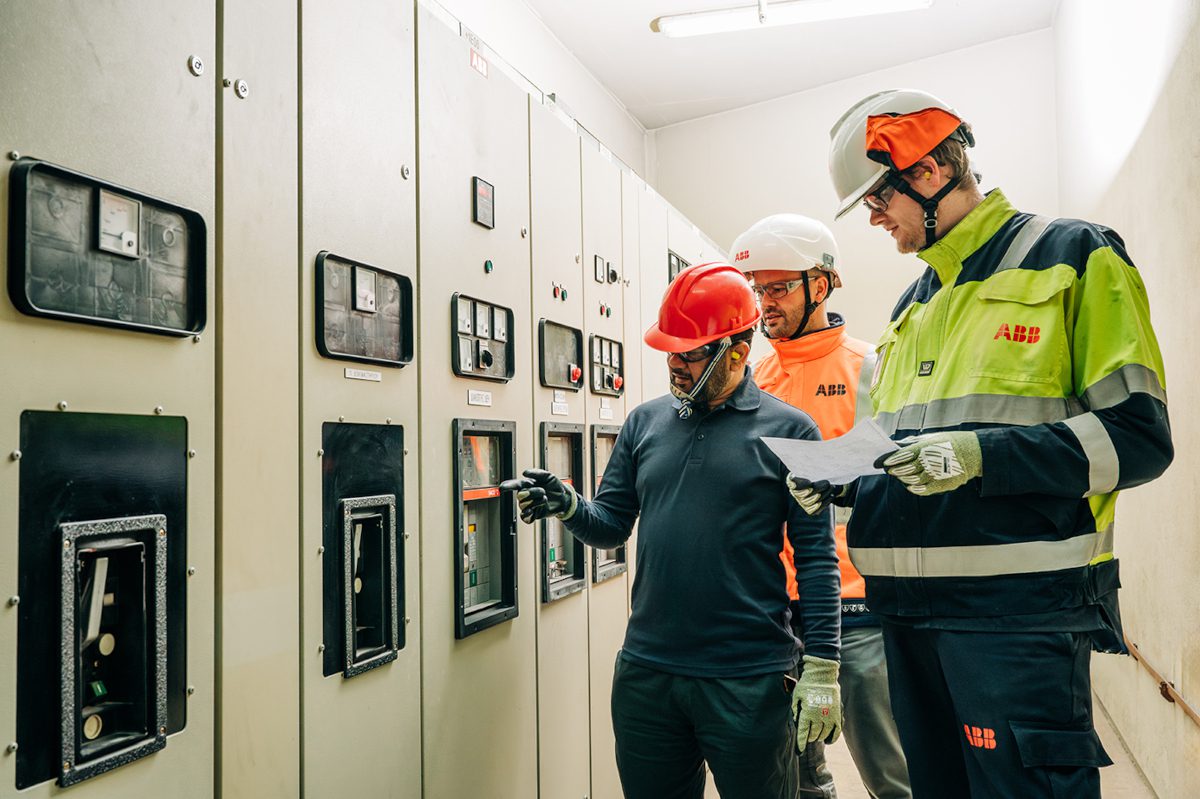 Engineers perusing a control panel