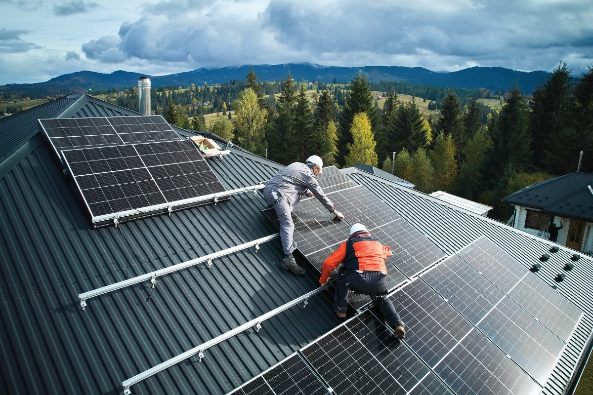 Rooftop solar panels being installed on a residential property