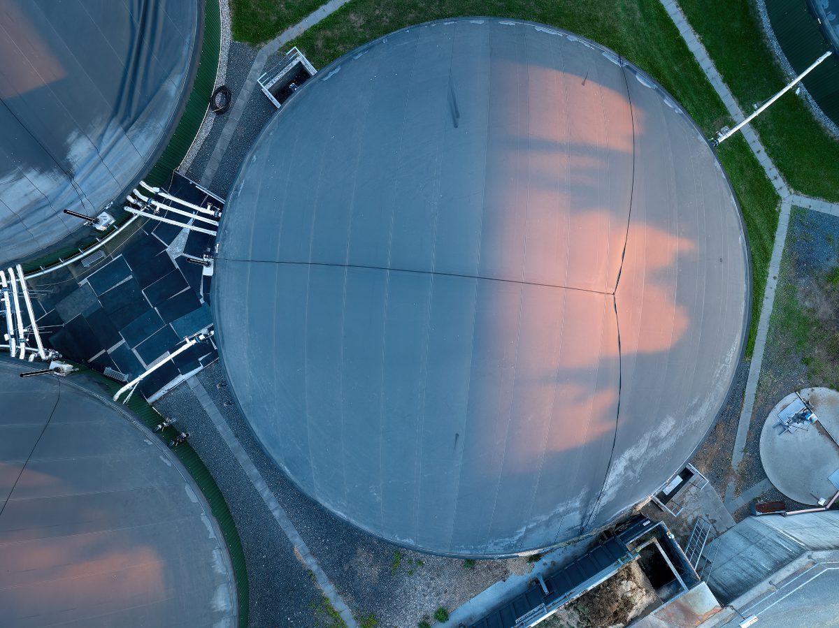 The circular outline of a biogas plant seen from above