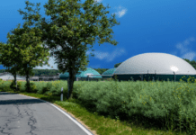 Optimise your anaerobic digestion site with a weather station expertly installed by Skyview round roofed buildings surrounded by trees and bushes