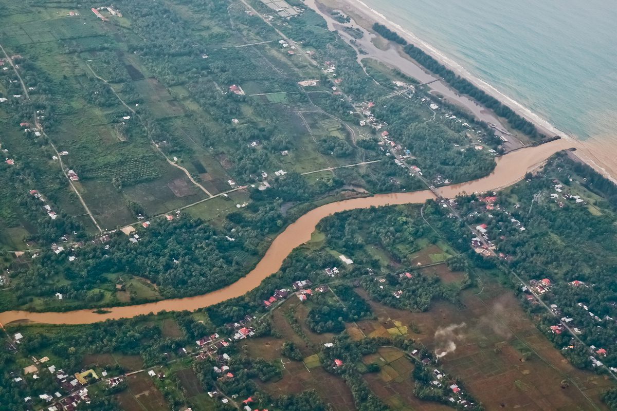 aerial view of river flow towards sea and catchment area