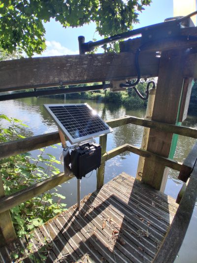 Portable solar-powered water quality monitoring station installed beside the River Medway.