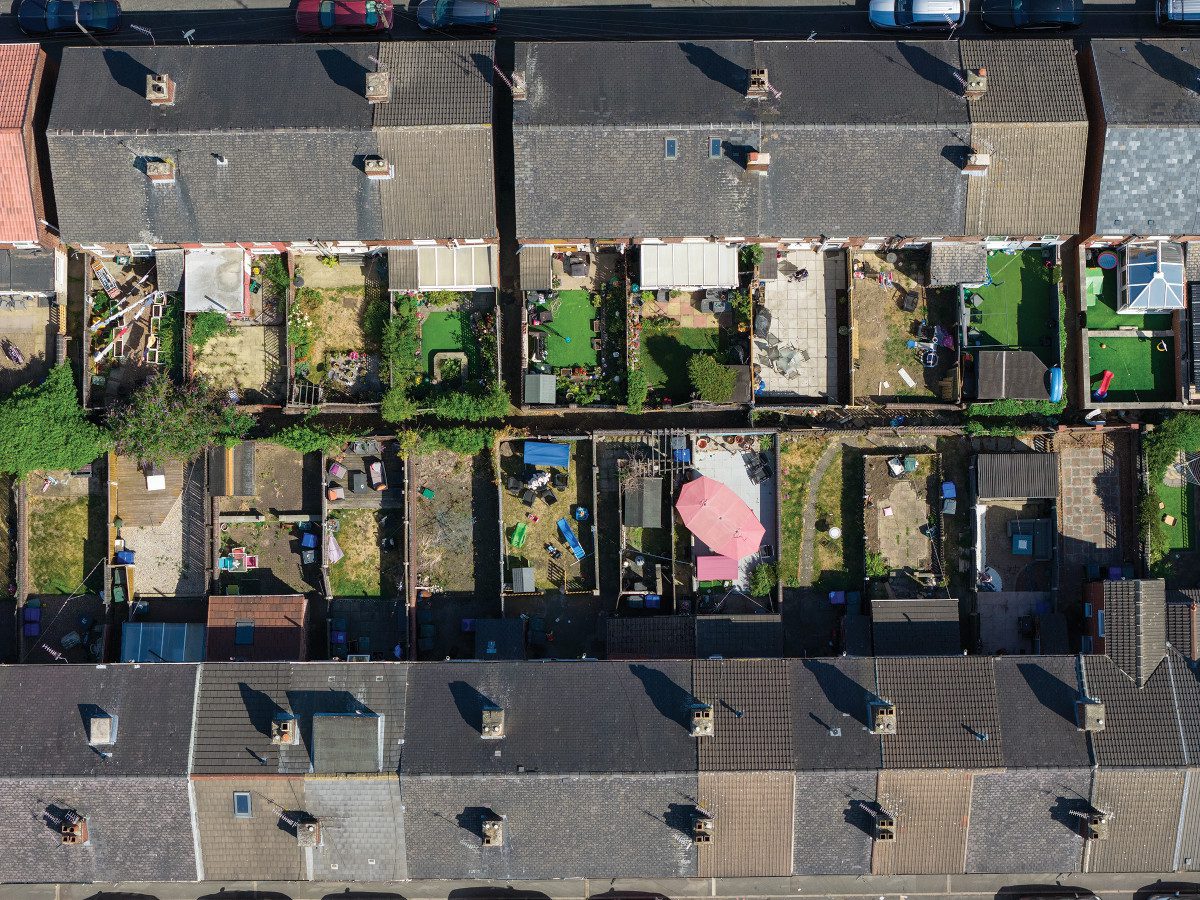 Aerial view of terraced houses and their adjoining back gardens